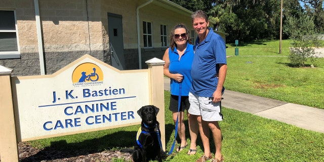 Puppy-raisers Kelly and Steve Shelton needed a place to go when the hurricane hit, and the Canine Companions facility in Orlando was happy to help.