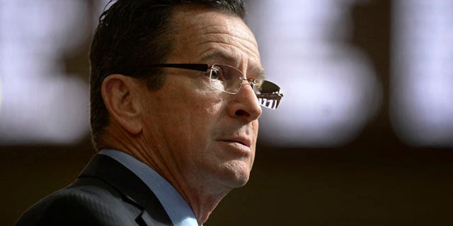 FILE- In this Feb. 8, 2017, file photo, Connecticut Gov. Dannel P. Malloy delivers his budget address to members of the house and senate inside the Hall of the House at the state Capitol in Hartford, Conn. Malloy made a last-ditch attempt Wednesday, June 28, to persuade leaders of the state House of Representatives to pass the three-month mini budget he crafted and avoid what will be deep cuts to everything from youth summer jobs and rental assistance programs. (AP Photo/Jessica Hill, File)