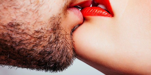 Close up of a men and woman lips wants to kiss.