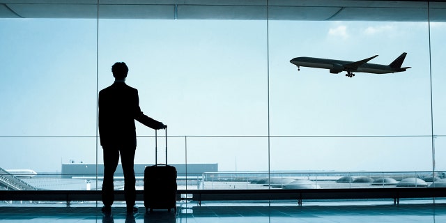 man at airport istock
