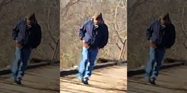 An image captured by Liberty German of a man walking near the trail around the time that her and her friend disappeared.