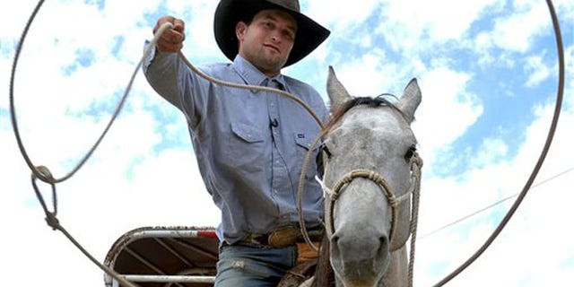 Robert Borba is being called a hero after chasing down an alleged bicycle thief with his horse Long John, and nabbing him with a lasso in a Wal-Mart parking lot, Friday, June 10, 2016, in Eagle Point, Ore. Borba was at the Eagle Point store loading dog food and a camping tent into his truck when he heard a woman screaming that someone was trying to steal her bike, the Medford Mail Tribune reports. Eagle Point police Sgt. Darin May said officers arrived and found the lassoed man and bike on the ground in the parking lot. (Denise Baratta/The Medford Mail Tribune via AP) MANDATORY CREDIT