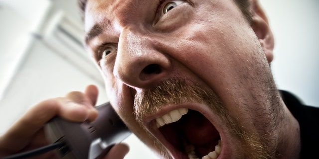 man yelling into phone istock medium