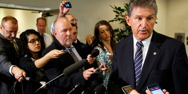 June 10, 2014: Senator Joe Manchin, D-W. Va., speaks to reporters outside of a closed-door Senate Armed Services Committee briefing on the Bergdahl prisoner swap at the U.S. Capitol in Washington.