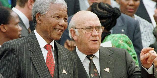 In this Wednesday May 8, 1996 file photo, South African President Nelson Mandela, left, and Deputy President F.W. de Klerk chat outside Parliament after the approval of South Africa's new constitution. de Klerk, the last leader of the apartheid era and a co-recipient of the 1993 Nobel Peace Prize with Nelson Mandela, has suffered dizziness and will be fitted with a pacemaker, Tuesday June 2, 2013, to help his heart function.