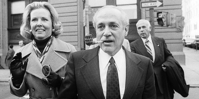 File-This Oct. 6, 2001, file photo shows Gov. Marvin Mandel, accompanied by his wife, Jeanne, walking to the federal courthouse in Baltimore.