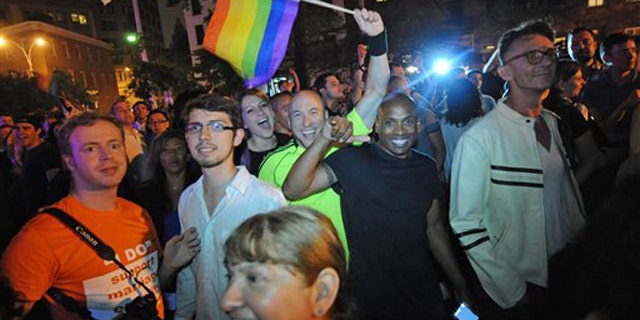 Revelers celebrate in Manhattan's west village following the passing of the same sex marriage bill June 24 in New York.