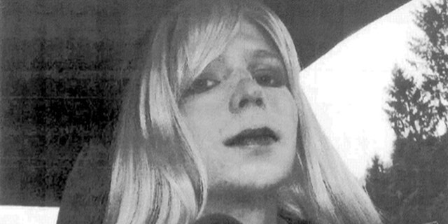 In this undated file photo provided by the U.S. Army, Pfc. Chelsea Manning poses for a photo wearing a wig and lipstick.