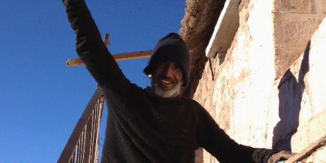 Sept, 8, 2013: Uruguayan man Raul Fernando Gomez Circunegui, 58, poses outside the shelter where he was found after disappearing four months ago in the remote Andes Mountains of San Juan Province.