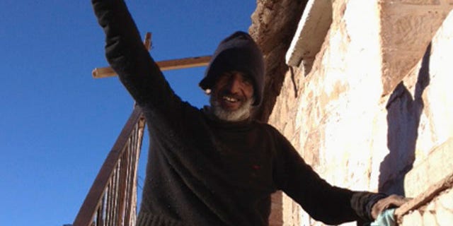 Sept, 8, 2013: Uruguayan man Raul Fernando Gomez Circunegui, 58, poses outside the shelter where he was found after disappearing four months ago in the remote Andes Mountains of San Juan Province.