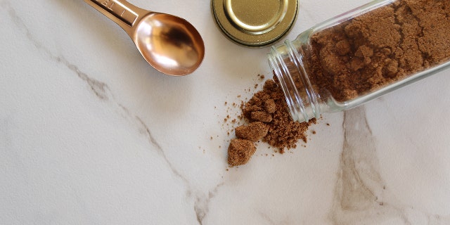 Cinnamon is shown poured on a countertop while baking.
