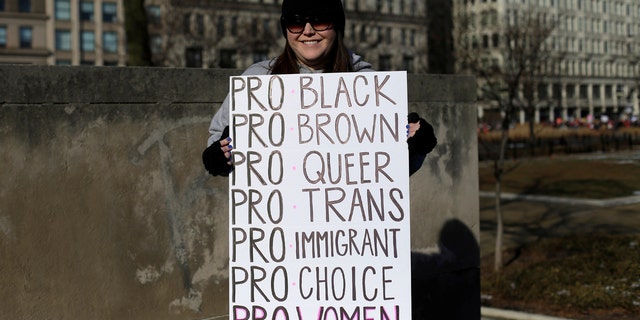 A demonstrator poses for a photo during the Women's March in Chicago on Jan. 20, 2018.