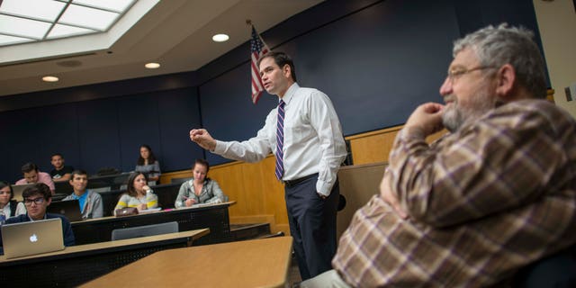 MIAMI, FL - FEBRUARY 9: Day in the life of Senator Marco Rubio on February 9, 2015 in Miami, Florida. Senator Rubio and his co professor, Dario Moreno (R) teach political science to their class at Florida International University. (Photos by Charles Ommanney for the Washington Post)