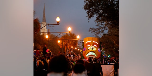 Floats ride down Canal street as the Mardi Gras parade rolls through New Orleans.