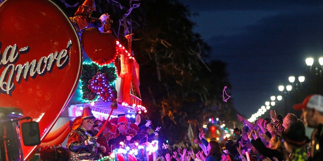 Float riders tossing beads during the Krewe of Bacchus Mardi Gras parade in New Orleans, in February.