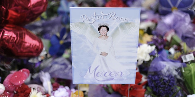 A sign with a photograph of Maren Sanchez at a memorial in 2014.