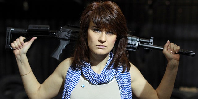 Maria Butina, a gun-rights activist, poses for a photo at a shooting range in Moscow, Russia.