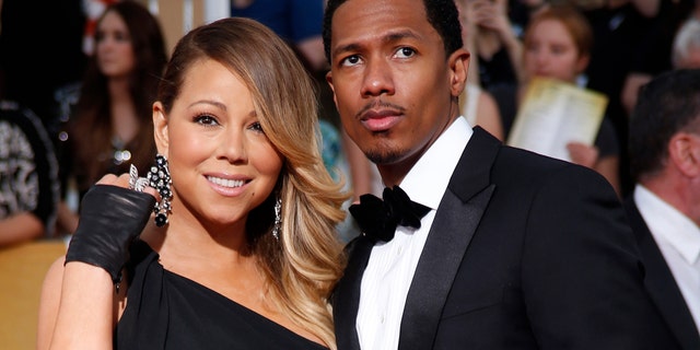 Mariah Carey and husband, Nick Cannon, arrive at the 20th annual Screen Actors Guild Awards in Los Angeles, California January 18, 2014.