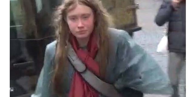 The unidentified woman is seen walking through the streets of Rome.