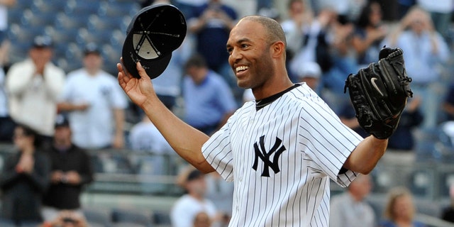 New York Yankees closer Mariano Rivera acknowledges the cheers of the crowd after recording his 602nd career save, after the Yankees beat the Minnesota Twins 6-4 at Yankee Stadium in New York, on Sept, 19, 2011.