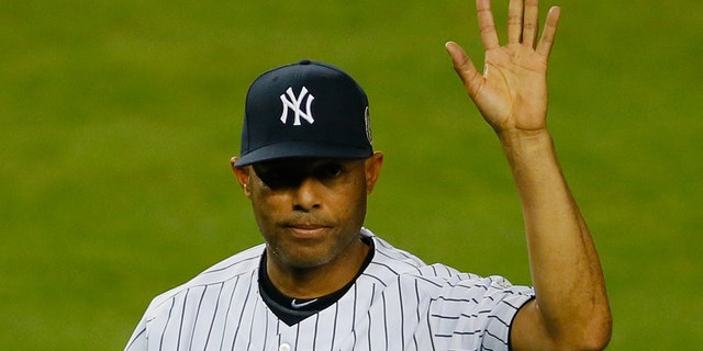 NEW YORK, NY - SEPTEMBER 26: Mariano Rivera #42 of the New York Yankees walks back to the dugout after collecting some dirt from the pitcher's mound after the game against the Tampa Bay Rays at Yankee Stadium on September 26, 2013 in the Bronx borough of New York City. (Photo by Mike Stobe/Getty Images)