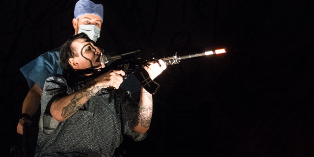 marilyn manson concert gun splash news