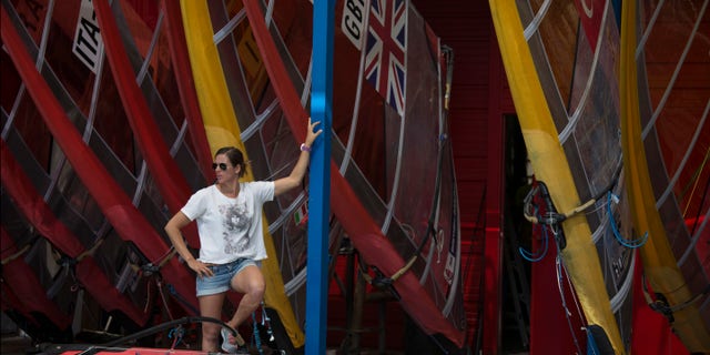 Marina Alabau, a Spanish windsurfer and a gold medalist at London Olympics, stands by her surf borads in Eliat, Israel, Friday, Feb. 19, 2016 as she prepares for the RS:X World Championship. Alabau said she got Zika while training in Brazil in December, making her possibly the first Olympic athlete to come down with a virus that the World Health Organization has deemed an "international health emergency." (AP Photo/Tsafrir Abayov)