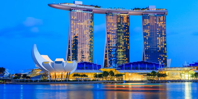 The Marina Bay Sands Resort is seen at twilight.