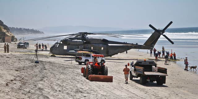 April 15, 2015: A Marine Corps helicopter sits in the sand where it made an emergency landing.