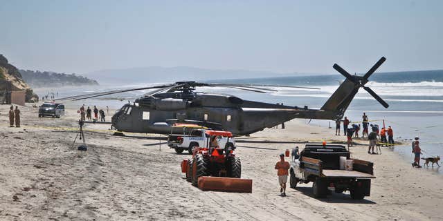 April 15, 2015: A Marine Corps helicopter sits in the sand where it made an emergency landing.