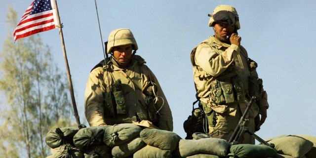U.S. Marine stand guard at the American military compound in Kandahar, Afghanistan.