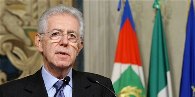 Nov. 13, 2011: Italy's new premier-designate economist Mario Monti meets with journalists at the Quirinale Presidential Palace after talks with Italian President Giorgio Napolitano in Rome. Monti told reporters Sunday night he will carry out the task "with a great sense of responsibility and service toward this nation."