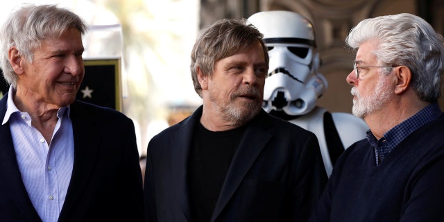 Harrison Ford, Mark Hamill and George Lucas stand together at Hamill's star ceremony.
