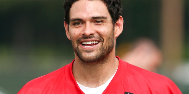 New York Jets quarterback Mark Sanchez smiles during Jets training camp practice in Cortland, New York, July 27, 2012.