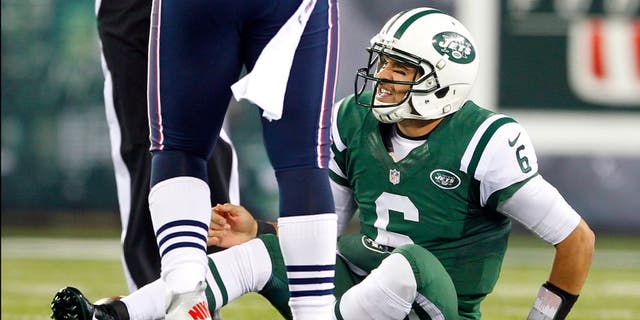 EAST RUTHERFORD, NJ - NOVEMBER 22: Quarterback Mark Sanchez #6 of the New York Jets reacts after getting sacked by the New England Patriots during a game at MetLife Stadium on November 22, 2012 in East Rutherford, New Jersey. (Photo by Rich Schultz /Getty Images)