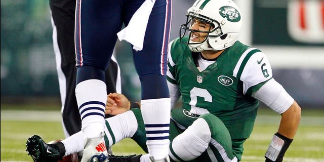 EAST RUTHERFORD, NJ - NOVEMBER 22: Quarterback Mark Sanchez #6 of the New York Jets reacts after getting sacked by the New England Patriots during a game at MetLife Stadium on November 22, 2012 in East Rutherford, New Jersey. (Photo by Rich Schultz /Getty Images)
