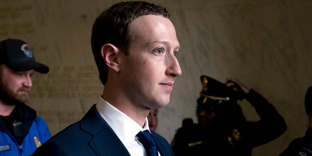 In this April 11, 2018, file photo, Facebook CEO Mark Zuckerberg departs after testifying before a House Energy and Commerce hearing on Capitol Hill in Washington about the use of Facebook data to target American voters in the 2016 election and data privacy.