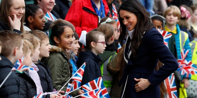 Markle greets students in Birmingham.