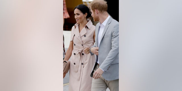 Britain's Prince Harry, right, and his wife Meghan the Duchess of Sussex arrive for their visit to the launch of the Nelson Mandela Centenary Exhibition, marking the 100th anniversary of anti-apartheid leader's birth, at the Queen Elizabeth Hall in London, Tuesday, July 17, 2018. (AP Photo/Matt Dunham)