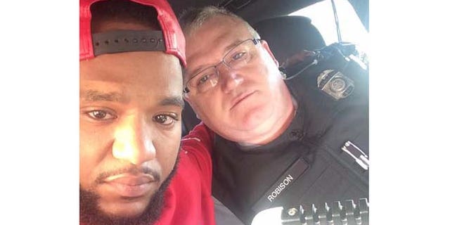 Mark Ross is pictured here in a photo with Sgt. David Robison that was posted to his Facebook page.