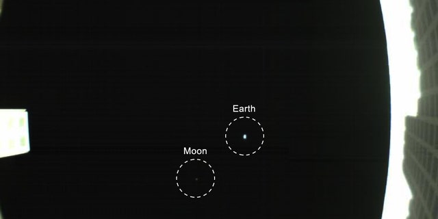 The Earth and moon star in this first photo from Wall-E, one of NASA's two Mars Cube One cubesats, that launched with the agency's InSight Mars lander on May 5, 2018. This view of Earth and the moon was taken May 9.