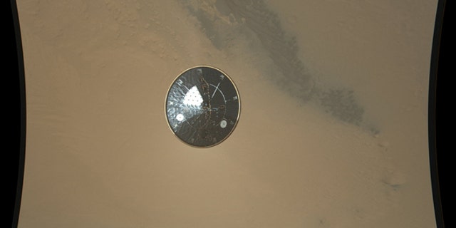 This color full-resolution image showing the heat shield of NASA's Curiosity rover was obtained during descent to the surface of Mars on Aug. 5 PDT (Aug. 6 EDT). The 15-foot heat shield was photographed by Curiosity's MARDI descent camera.