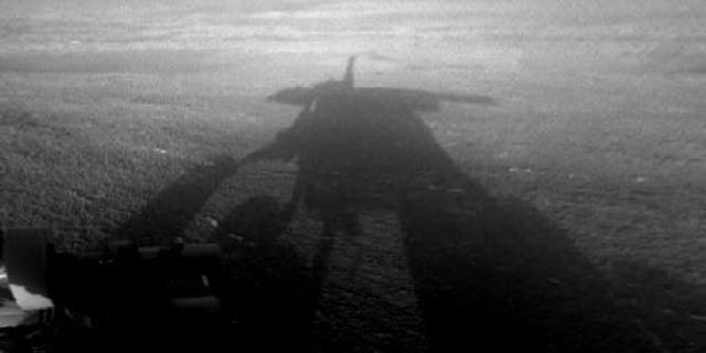 NASA's Mars Exploration Rover Opportunity captured this view of its afternoon shadow stretching into Endeavour Crater during the 3,051st Martian day, or sol, of Opportunity's work on Mars on Aug. 23, 2012.