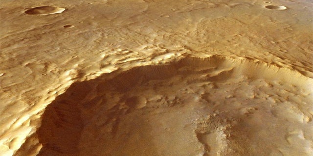 This large crater, which measures15 miles (25 kilometers) across, has excavated rocks which have been altered by groundwater in the crust before the impact occurred. Using ESA's Mars Express and NASA's Mars Reconnaissance Orbiter, scientists have identified hydrated minerals in the central mound of the crater, on the crater walls and on the large ejecta blanket around the crater.