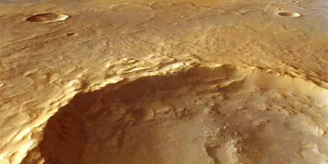 This large crater, which measures15 miles (25 kilometers) across, has excavated rocks which have been altered by groundwater in the crust before the impact occurred. Using ESA's Mars Express and NASA's Mars Reconnaissance Orbiter, scientists have identified hydrated minerals in the central mound of the crater, on the crater walls and on the large ejecta blanket around the crater.