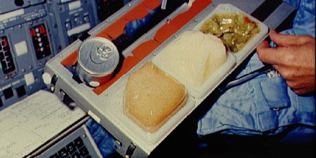 Astronauts en route to Mars may not have it as easy as this space shuttle astronaut — they may have to grow their own food.