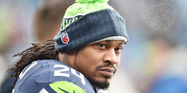 Marshawn Lynch #24 of the Seattle Seahawks looks on before the NFC Divisional Playoff game against the Carolina Panthers at Bank of America Stadium on January 17, 2016 in Charlotte, North Carolina.