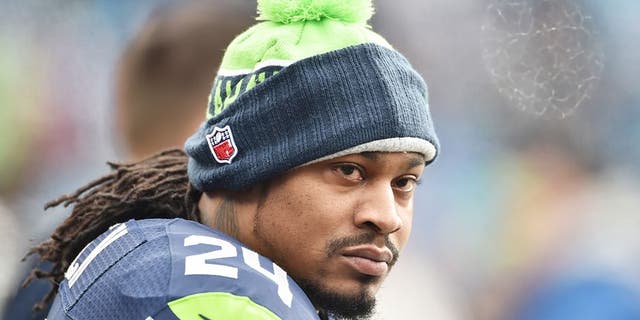 Marshawn Lynch #24 of the Seattle Seahawks looks on before the NFC Divisional Playoff game against the Carolina Panthers at Bank of America Stadium on January 17, 2016 in Charlotte, North Carolina.