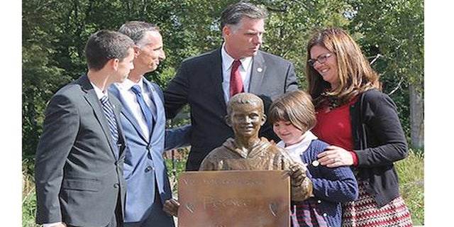 A life-size sculpture of Boston Marathon bombing victim Martin Richard unveiled Saturday Sept. 26, 2015, at Bridgewater State University.(John Waters/BSU)