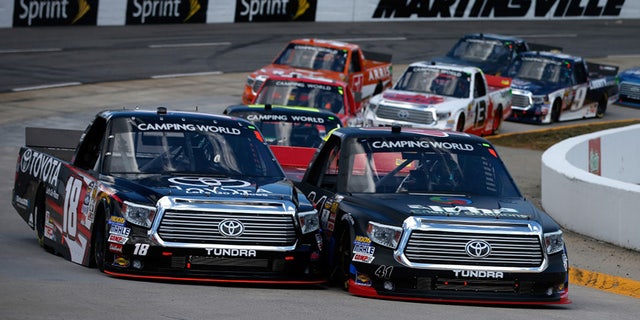 Camping World trucks battle it out on the banks of Martinsville Speedway.